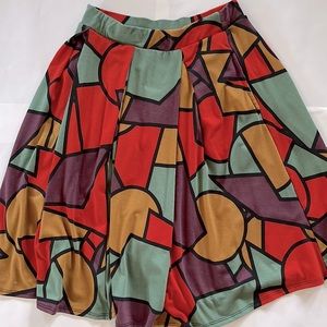 Lularoe woman’s stretchy skirt size small with pockets 70’s-80’s vibes abstract